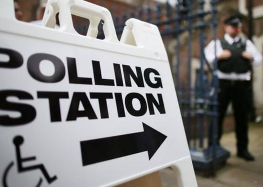 image shows a sign outside a polling station. The wording is 